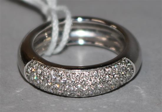 A modern 18ct white gold and pave set diamond half hoop ring, size N.